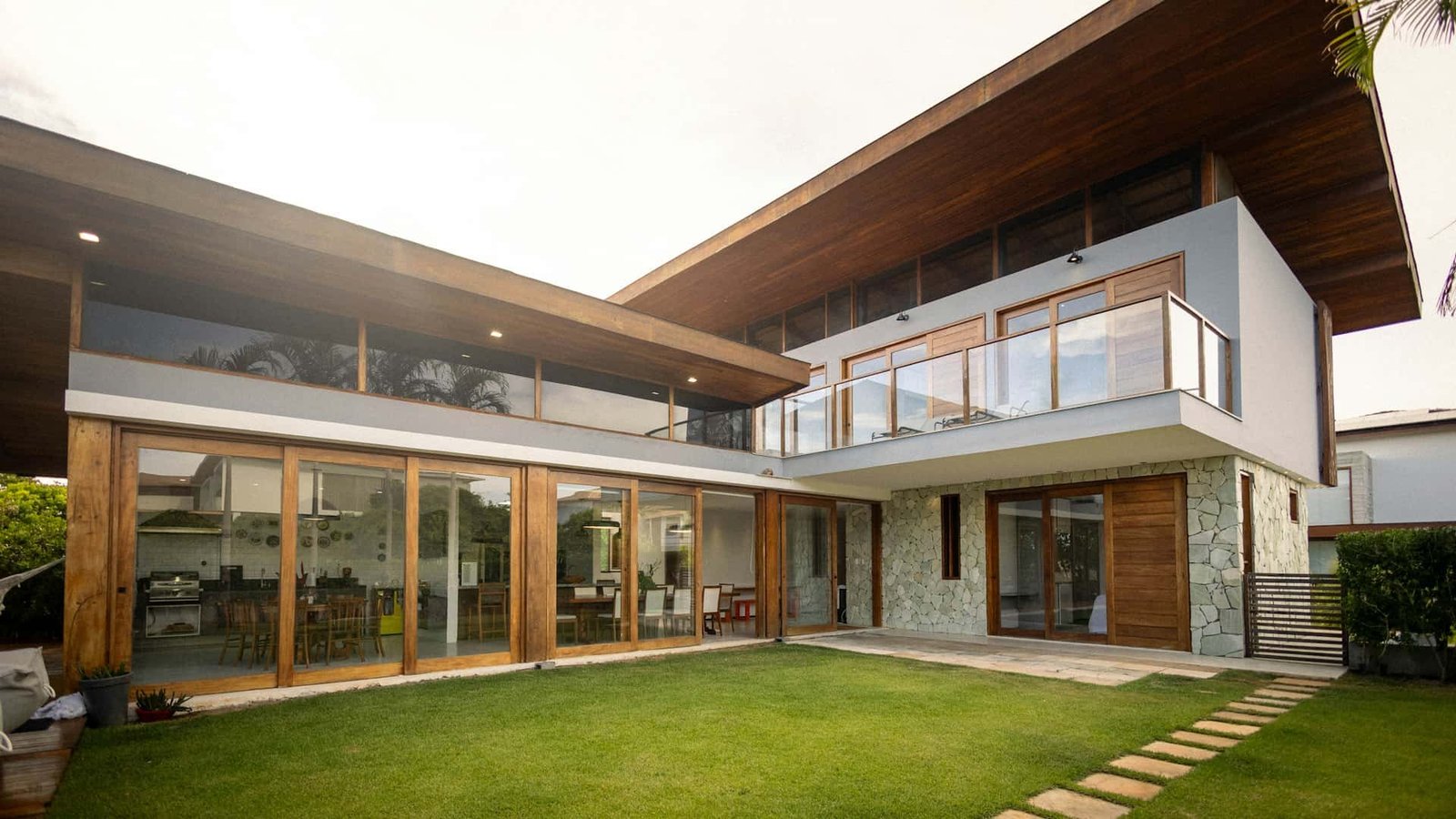 Contemporary villa with large-format aluminium glazing, where whole-window Uw and shading coefficient determine cooling load