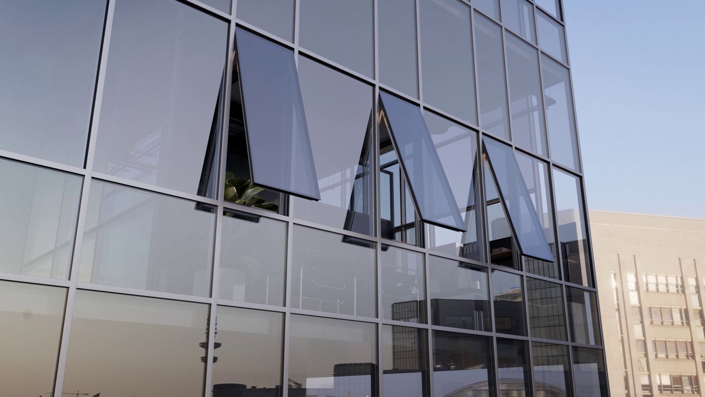 Aluminium glazed facade where most panes are fixed lights and a few top-hung vents open for ventilation, limiting opening joints to where air is needed